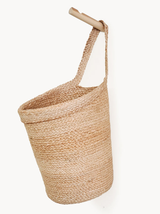 Woven basket with a handle on a white background
