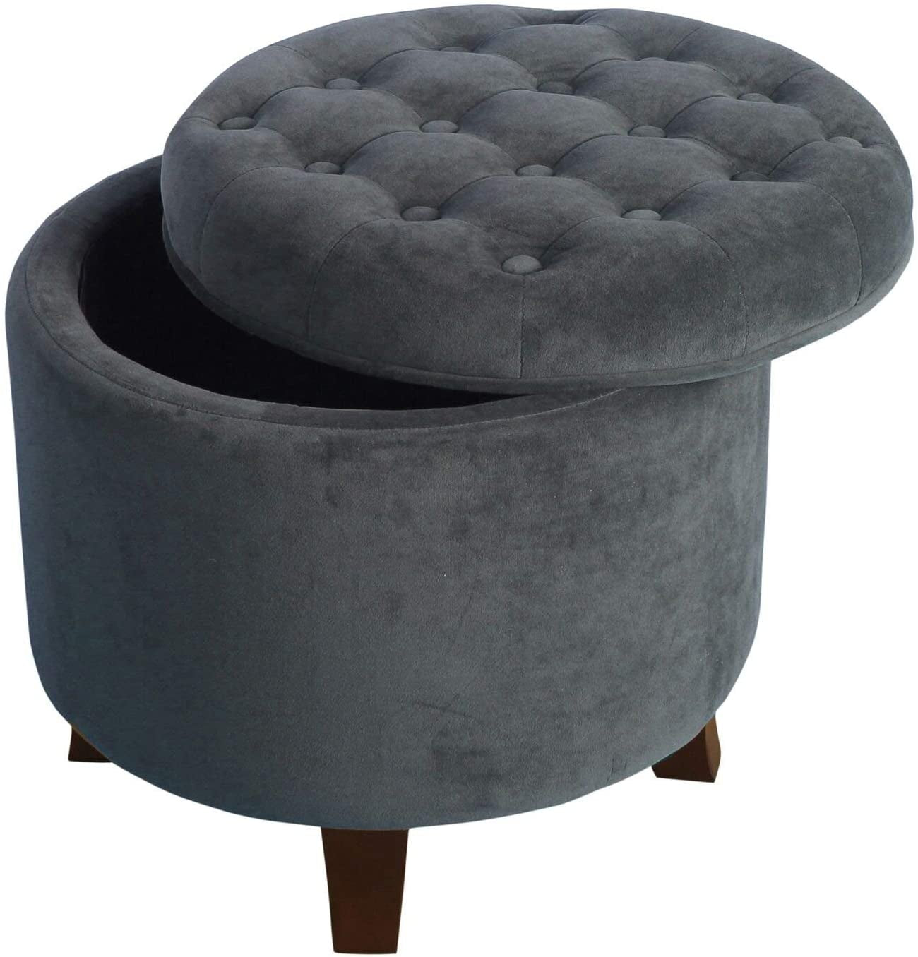 Gray tufted storage ottoman with wooden legs on a white background