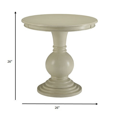 Round beige table with dimensions indicated on a white background