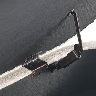 Close-up of a black metal bracket on a gray surface
