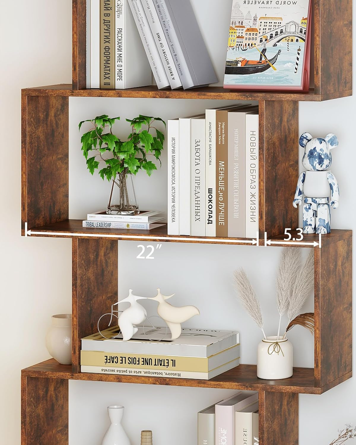 Wooden bookshelf with books, plants, and decorative items against a white wall.