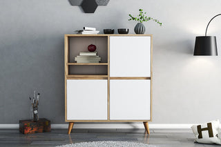 Modern wooden cabinet with white doors in a minimalistic room.