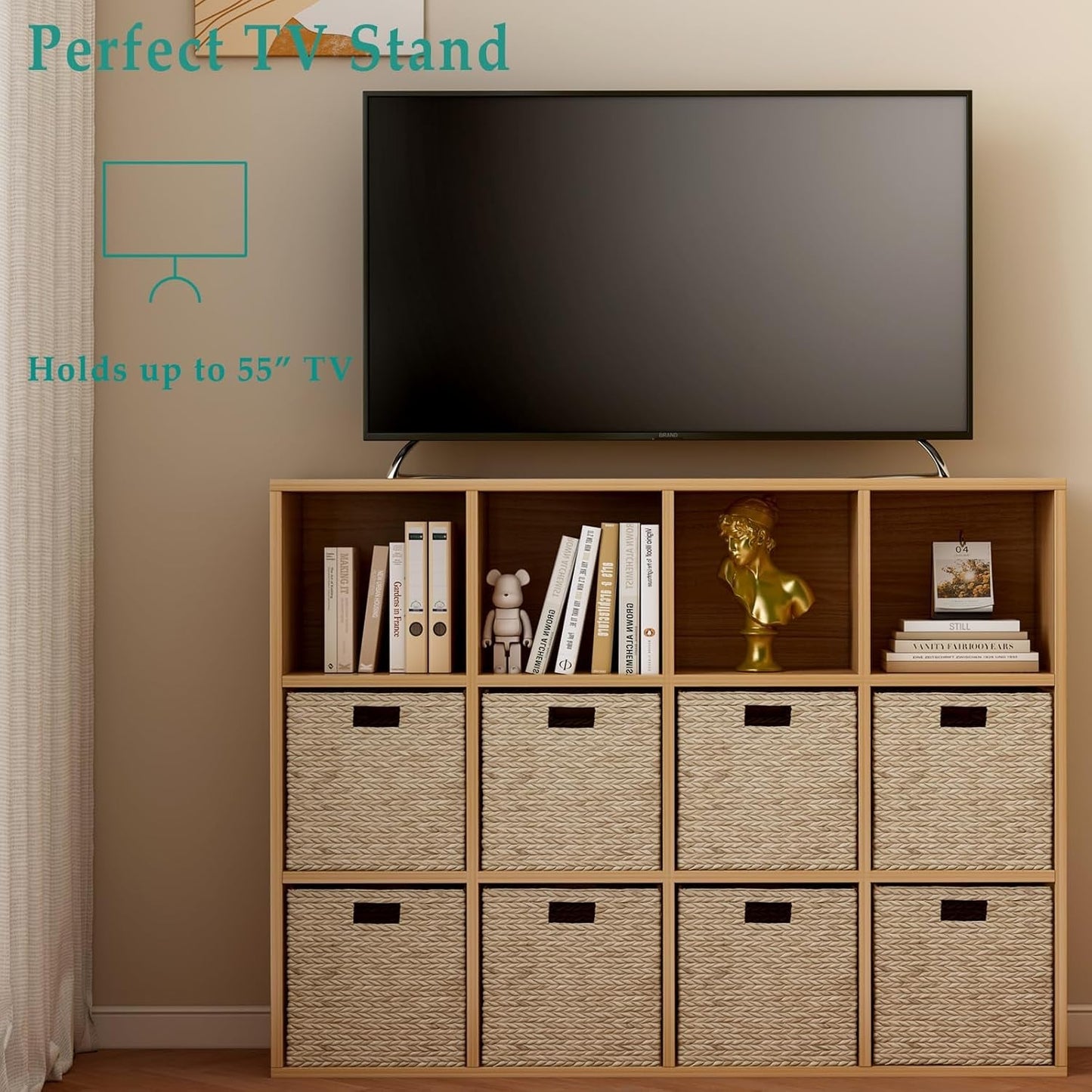 Wooden TV stand with storage baskets and a television mounted on it against a beige wall.